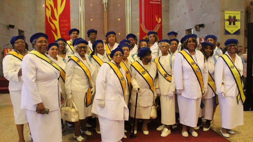 Members of Clara Ann Martin Chapter 39 of the Knights of Peter Claver, Gracious Ladies Auxiliary, Fourth Degree, an international Catholic fraternal service order, gather for a last photo after the closing Mass at SS. Monica and Luke in Gary on May 24. The group, which includes three members from Gary and others from throughout the Chicagoland area, has been meeting at SS. Monica and Luke for years, and will now move to the Cathedral of the Holy Angels, also in Gary, to meet at 10 a.m. on the first Saturday