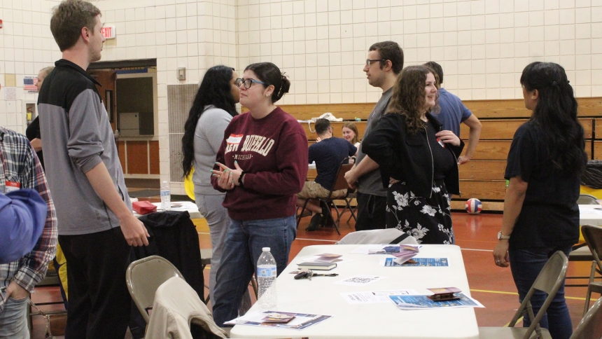 Young people exchange names and answer three questions about themselves as they mingle before a Young Adult Summer Speaker Series in Dyer on June 4, 2025. Up to 90 participants have enjoyed the Diocese of Gary sessions for the past three years, and a new slate of speakers is scheduled this summer at different parishes each Wednesday. (Marlene A. Zloza/file photo)