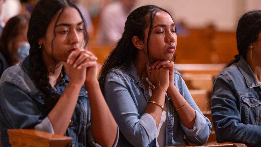 Two young women participate in a worldwide rosary for peace May 30, 2026, at the Basilica of the National Shrine of the Immaculate Conception in Washington. Archbishop Gabriele G. Caccia, apostolic nuncio to the United States, led the rosary at the basilica, while Pope Leo XIV presided over the Marian devotion from the Lourdes grotto in the Vatican Gardens, uniting Marian shrines around the world. (OSV News photo/Mihoko Owada, Catholic Standard)