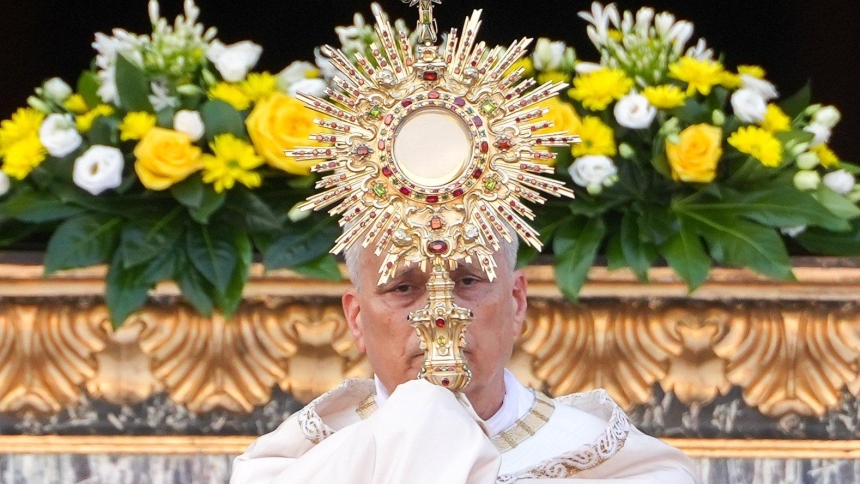 Pope Leo XVI raises the monstrance during Benediction after a Corpus Christi procession to Rome's Basilica of St. Mary Major June 22, 2025. (CNS photo/Lola Gomez)