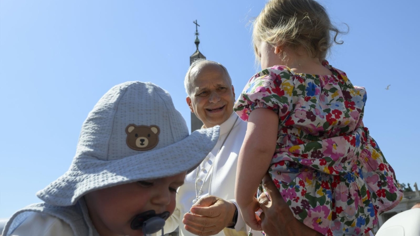 Pope Leo XIV greets a child from the popemobile while riding around St. Peter’s Square at the Vatican before his weekly general audience June 17, 2026. (CNS photo/Vatican Media)