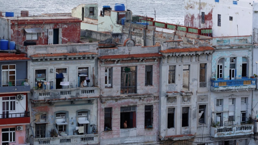 People stand on their balconies in Havana during a blackout June 17, 2026. The Cuban government on June 18 announced far-reaching economic measures that could mark the most significant shift toward a market economy since the 1959 revolution. (OSV News photo/Norlys Perez, Reuters)