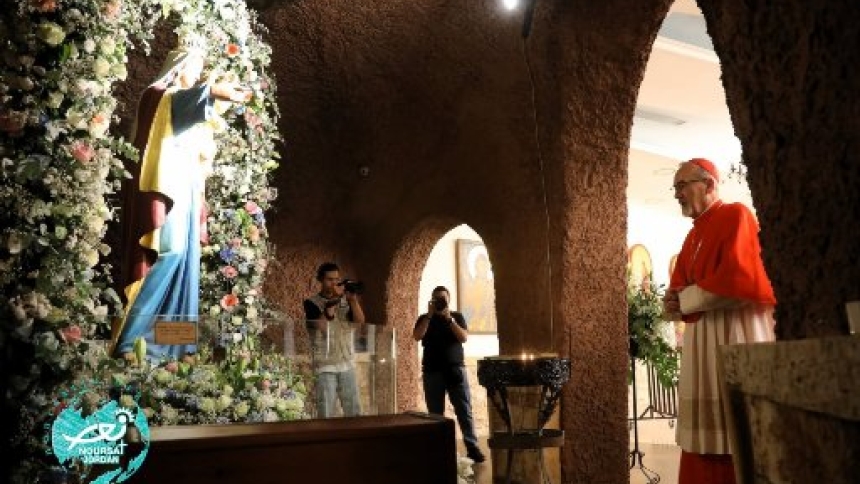 Cardinal Pierbattista Pizzaballa, Latin patriarch of Jerusalem, venerates the statue of the Virgin Mary with the Christ child in Anjara, Jordan, before celebrating a Mass at the church there June 19, 2026. (OSV News photo/courtesy Noursat Jordan)