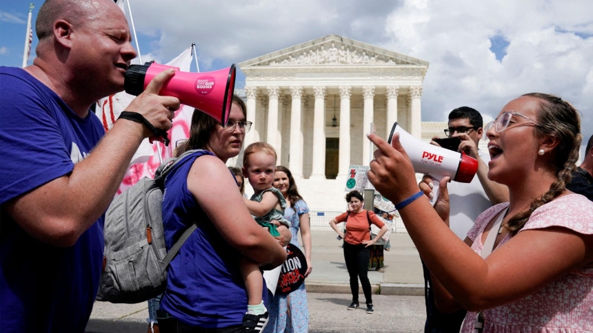 A pro-life activist and a supporter of legal abortion square off with megaphones in front of the U.S. Supreme Court in Washington June 24, 2023, the first anniversary the court's 2022 ruling in Dobbs v. Jackson Women's Health Organization, overturning Roe v. Wade, which legalized abortion nationwide in 1973. On the fourth anniversary of Dobbs June 24, 2026, the U.S. bishops' pro-life chair and pro-life leaders pointed to abortion pills as among key challenges for protecting the lives of unborn children. (OS