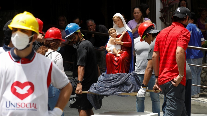 People transport an undamaged statue of the Mary and the Christ Child near the site of a damaged building in Caracas, Venezuela, June 25, 2026, following 7.2 and 7.5 magnitude earthquakes that rocked the country June 24. The death toll reached at least 1,450 and thousands more were injured, Venezuelan government officials reported June 28. Rescuers from around the world have arrived in the country to assist in rescue efforts. (OSV News photo/Fausto Torrealba, Reuters)