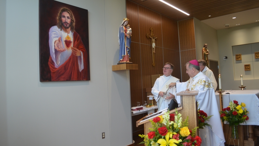 Bishop McClory blesses painting at Franciscan Health