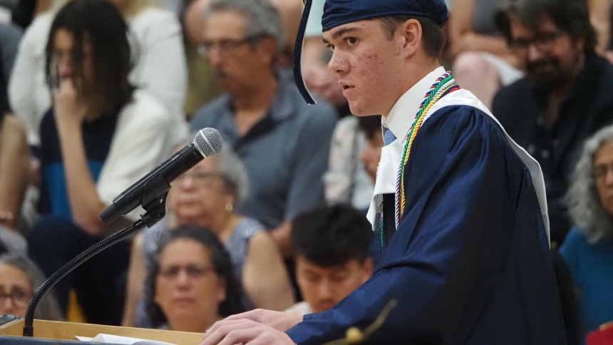 Marquette Catholic High School valedictorian Anthony Pecoski gives an emotional speech during commencement ceremony in the Scholl Center on June 10. (Deacon Bob Wellinski photo)