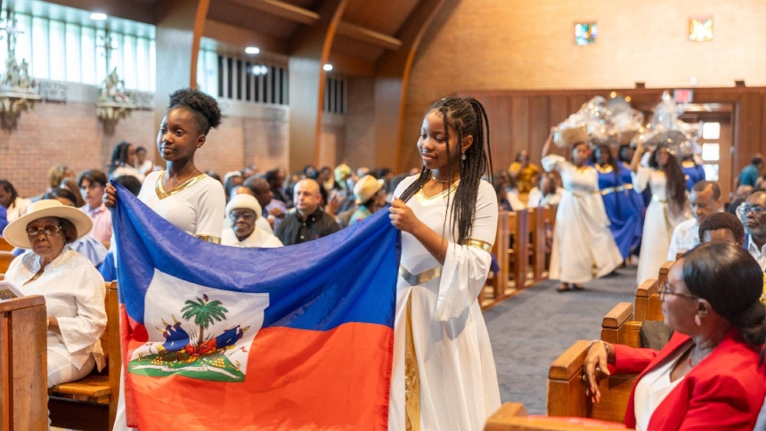 Carrying the flag of Haiti and baskets with fruits and vegetables that are grown in the country, girls and young women lead an offertory procession during a Mass on June 28, 2026, for the feast day of Our Lady of Perpetual Help, the patroness of Haiti. at Our Lady of Sorrows Church in Takoma Park, Md. The was celebrated for the Haitian Catholic community of Washington. (OSV News photo/Mihoko Owada, Catholic Standard)