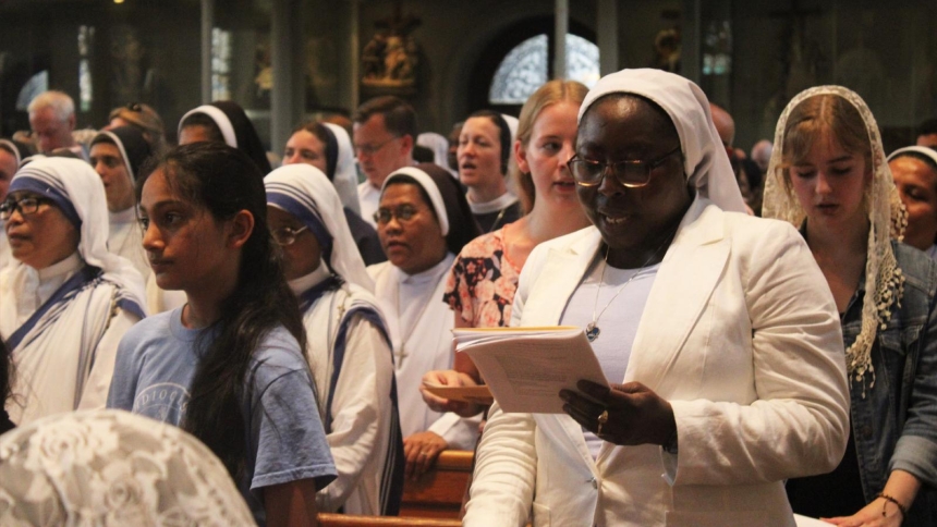 Faithful sing at St. Peter the Apostle Church in Philadelphia July 5, 2026, during the final Benediction of the 2026 National Eucharistic Pilgrimage, which concluded in that city amid the U.S.'s 250th anniversary celebrations. (OSV News photo/Gina Christian)
