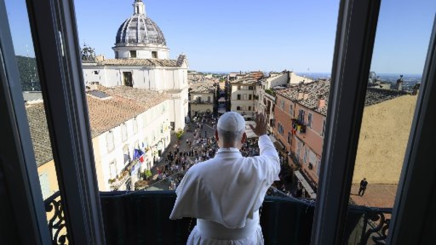 Pope Leo XIV greets visitors from the balcony of the papal Castel Gandolfo residence in Italy July 5, 2026. (OSV News photo/Simone Risoluti, Vatican Media)
