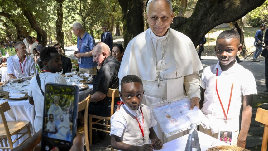 Pope Leo XIV poses for a photo with two young boys at a lunch with vulnerable people from the Diocese of Rome at Borgo Laudato Si, in the pontifical gardens of Castel Gandolfo, Italy, July 11, 2026. (OSV News photo/Simone Risoluti, Vatican Media)