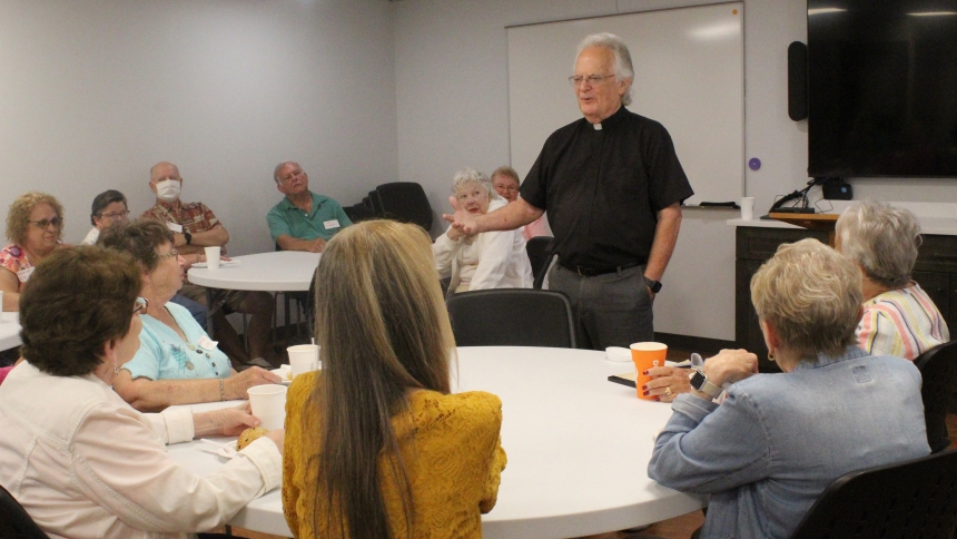 “When you meet  (after Mass) for coffee and doughnuts, what do you talk about?” Father Jerry Schweitzer asked parish leaders meeting with him on July 11 for a Coffee and Conversation session on “Hospitality for Those 50+ in Your Parish” at the Diocese of Gary’s Pastoral Center in Merrillville. “Do we pass on to others (what we talk about) during the week, because that’s what we are supposed to do,” he advised a gathering of close to 50 people. (Marlene A. Zloza photo)