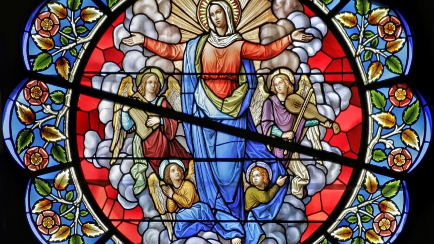 The reception of Mary into heaven is depicted in the center section of a rose window at Sts. Peter and Paul Cathedral in Providence, R.I. The feast of the Assumption of the Blessed Virgin Mary, Aug. 15, celebrates the belief that Mary was taken body and soul into heaven at the end of her life. (OSV News photo/Crosiers)