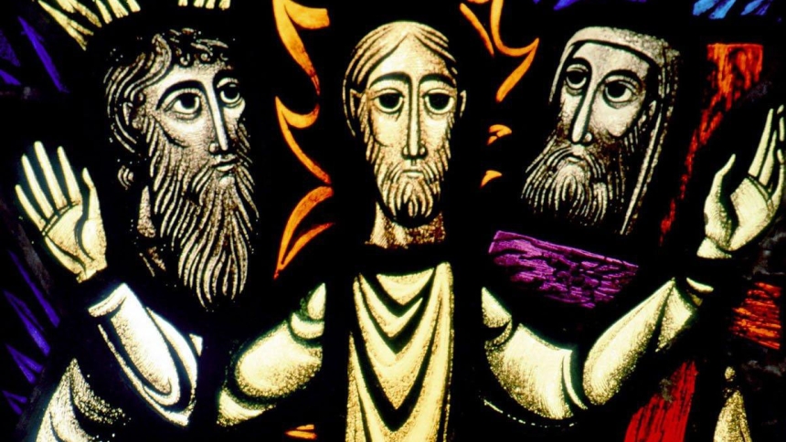 A church window depicts the transfiguration of Christ, in which Moses and Elijah are seen with Jesus in a glorified state before the apostles Peter, James and John. (OSV News photo/Crosiers)