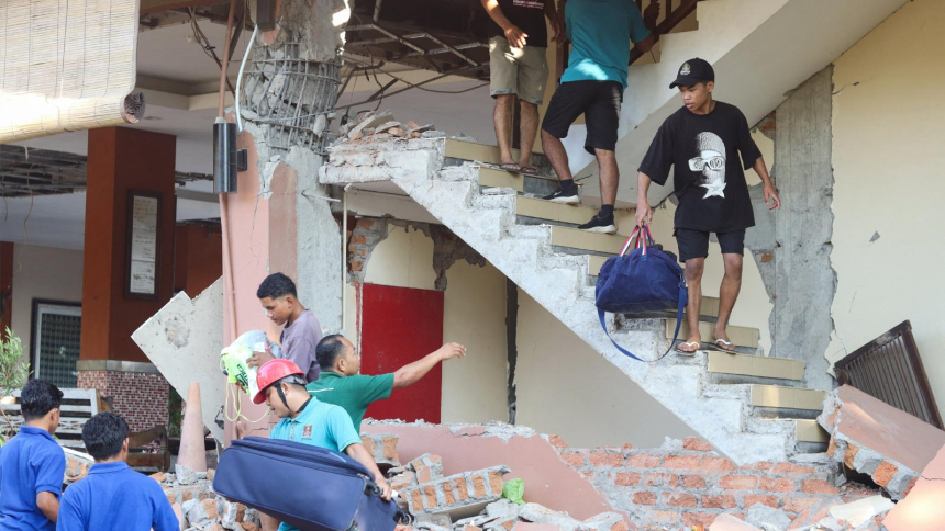 People evacuate from a building collapse at Jayakarta hotel following an earthquake of magnitude 7.7, in Labuan Bajo, East Nusa Tenggara, Indonesia, Aug.15, 2026. Earlier that day, a powerful 7.7-magnitude earthquake struck the country's eastern coast, killing over 50 people and leaving thousands displaced in the aftermath. (OSV News photo/Stringer, Reuters)