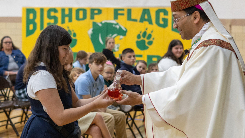 A student from Bishop Flaget Catholic School in Chillicothe, Ohio, presents Bishop Earl K. Fernandes with gifts during an all-school Mass Sept. 5, 2025. Amid political, social and economic turmoil, Catholic education is "a sign of hope," said Bishop Fernandes in a pastoral letter released Aug. 18, 2026. (OSV News photo/Sarah Lightle, courtesy Diocese of Columbus)