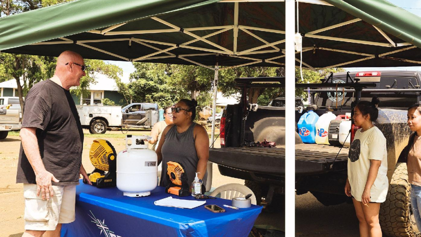 Steve Brock with the Order of St. Lazarus chats with EPIC Ministry members Aug. 21, 2026, who were giving out propane and propane tanks to residents in Hawaii island’s Kau district so they could cook during the extended power outage after Hurricane Lala barreled across the Hawaiian Islands Aug. 15-16. (OSV News photo/Lisa Dahm, Hawaii Catholic Herald)