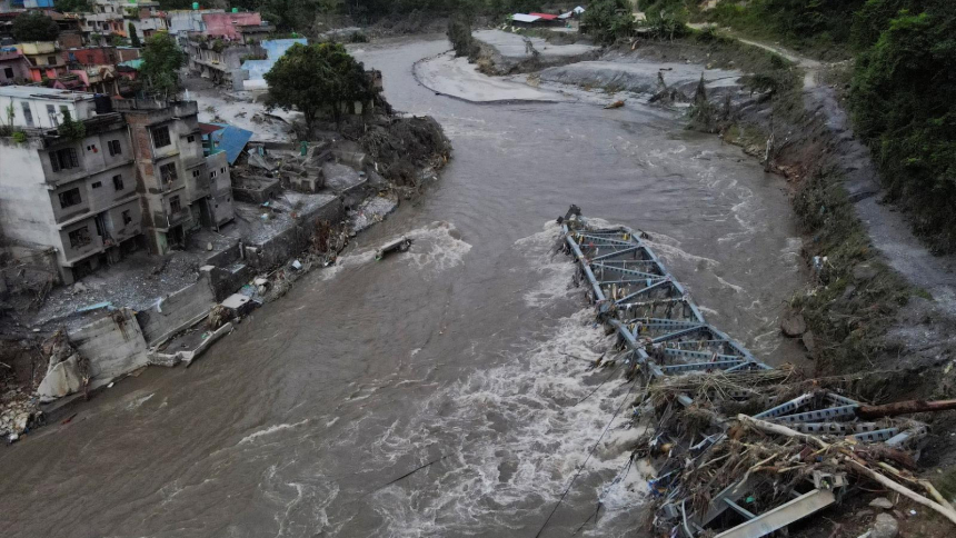 A drone view of a broken bridge and damaged houses after the flash floods and mudslide, at Devighat, Nuwakot district, Nepal, Aug. 28, 2026. (OSV News photo/Francis Mascarenhas, Reuters)