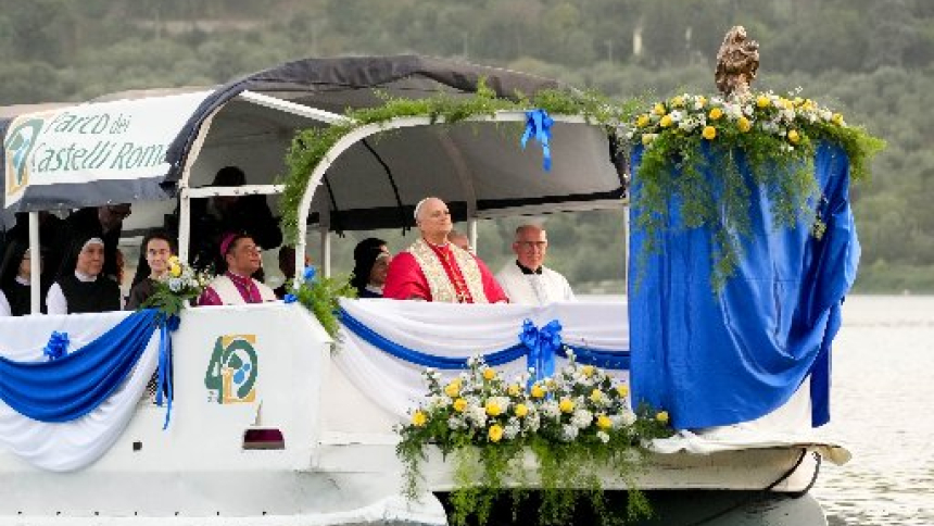 Pope Leo XIV looks toward a statue of Our Lady of the Lake as a boat begins to move across Lake Albano during a Marian procession in Castel Gandolfo, Italy, Aug. 29, 2026, the feast of Our Lady of the Lake. (CNS photo/Lola Gomez)
