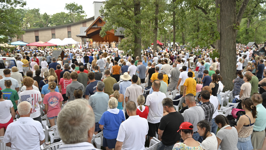 Thousands of faithful are gathered at the Shrine of Our Lady of Częstochowa during Sunday Mass on the second day of the Piesza Polonijna Pielgrzymka Maryjna (Polish Marian Walking Pilgrimage) in Merrillville on August 9. Predominantly Polish Catholics participated in the 39th annual event in which walkers made their way from the South Side of Chicago to Munster and Merrillville in praise and petition. (Anthony D. Alonzo photo)