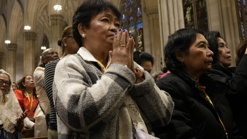 A woman prays during a Mass hosted by the Filipino Catholic Apostolate of the Archdiocese of New York at St. Patrick's Cathedral in New York City May 24, 2026. (OSV News photo/Gregory A. Shemitz)