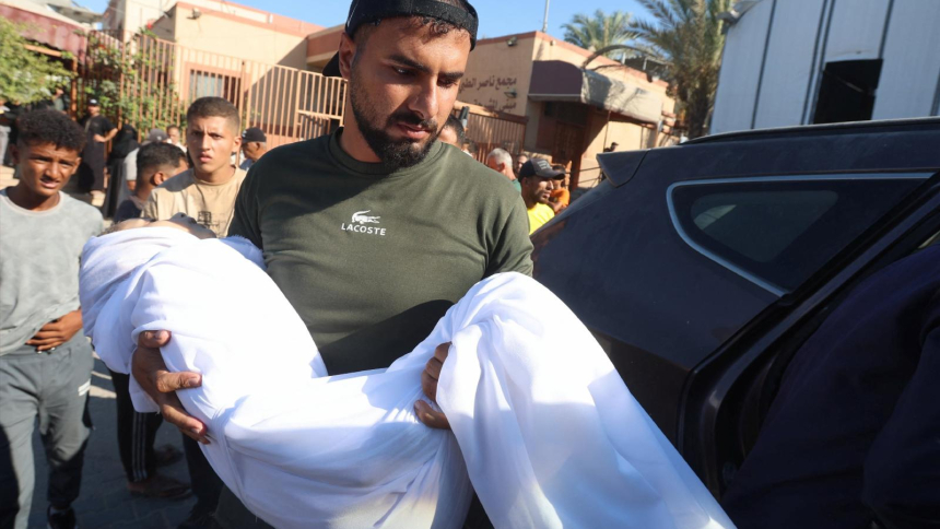 A man carries the body of of a 10-year-old Palestinian girl during her funeral in the southern Gaza Strip, Aug. 24, 2026. She was shot in the back while eating inside her family's tent and later died at Nasser Hospital in Khan Younis, according to medics and relatives. A network of Catholic priests in Africa has become the latest group to declare genocide in Gaza, as the United Nations reports continuing airstrikes, deaths and injuries, amid a shaky ceasefire in the area. (OSV News photo/Ramadan Abed, Reute