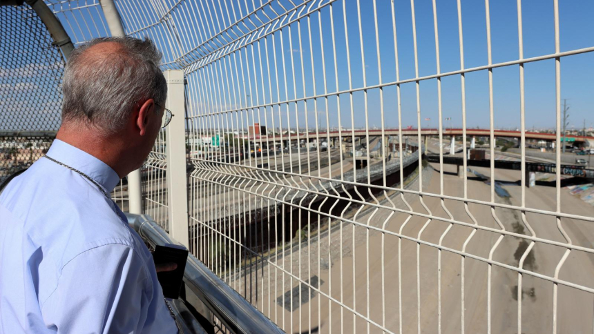 Archbishop Stefan Hesse of Hamburg, who is the special representative for refugee issues for the German Bishops' Conference, looks through the U.S.-Mexico border fence Aug. 25, 2026, after returning from Ciudad Juárez, Mexico, to El Paso, Texas. (OSV News photo/Daniela Elpers, courtesy German Bishops Conference)