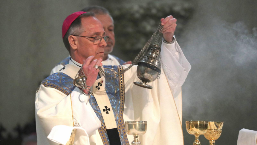 Indianapolis Archbishop Charles C. Thompson swings the censer over the altar as he celebrates a Mass to welcome pilgrims at St. John the Evangelist Church in Indianapolis July 16, 2024, just ahead of the National Eucharistic Congress. The Archdiocese of Indianapolis has provided a dispensation to Catholics who fear being targeted by immigration enforcement going to and from Sunday Mass regardless of their legal status. (OSV News photo/Bob Roller)