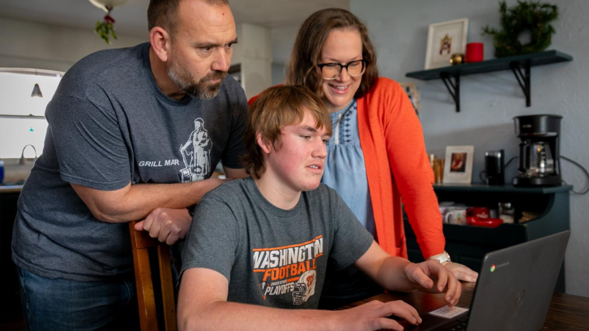 James Engstrom, then 15, who has a great interest in meteorology as a hobby, shows his parents, Travis and Bonnie, the weather forecast at their home in Washington, Ill., Jan. 23, 2026. James Engstrom, who was born without a pulse on Sept. 16, 2010, and remained clinically dead for an hour before his heart began beating, led to a Church-approved miracle that helped advance the cause for Venerable Fulton J. Sheen's beatification. (OSV News photo/Daryl Wilson)