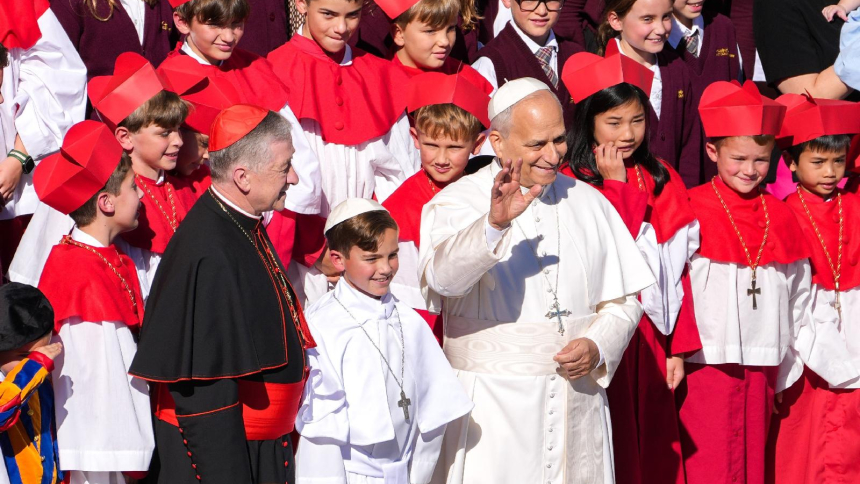 Pope Leo XIV poses for a photo with students from Our Lady of Mount Carmel Academy in Chicago, including fourth-grader Augie Wilk, dressed as a pope, and Cardinal Blase J. Cupich of Chicago, at the conclusion of the pope's weekly general audience in St. Peter's Square at the Vatican Oct. 8, 2025. As Pope Leo recovers from surgery Oct. 13, 2026, during which doctors removed his lower right lung to treat a cancerous tumor, a group of students from the Chicago school are sending him get-well cards and Chicago 