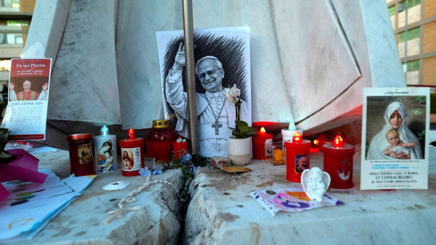 Images of Pope Leo XVI and other objects are displayed at the base of the statue of St. John Paul II outside Rome's Gemelli Hospital Oct. 15, 2026. Doctors treating Pope Leo XIV said Oct. 15 that tests show "good recovery of the operated lung" two days after his cancer surgery. The pope underwent surgery Oct. 13 to remove the lower lobe of his right lung and was diagnosed with lung cancer. (OSV News photo/Remo Casilli Reuters)