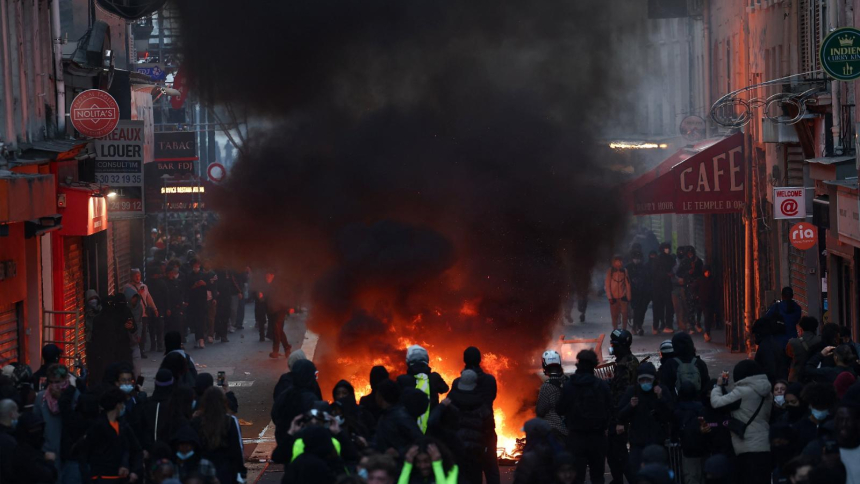 Flames and smoke rise in Paris Oct. 18, 2026, the day after a national day of demonstrations against the cost of living and rising fuel prices. (OSV News photo/Abdul Saboor, Reuters)