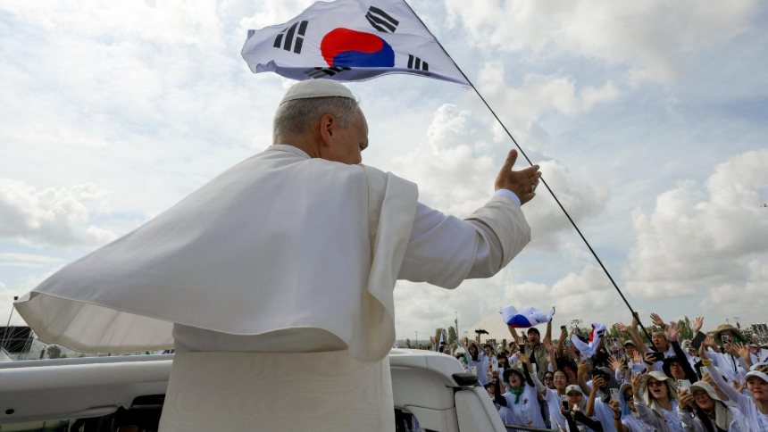 A South Korean flag is seen as Pope Leo XIV gestures to pilgrims Aug. 3, 2025, the day of the closing Mass for the Jubilee of Youth at the Tor Vergata open-air field in Rome. On Oct. 22, 2026, the pope launched the opening of registrations for the 41st World Youth Day set to take place Aug. 3–8, 2027, in Seoul, South Korea. (OSV News photo/Vatican Media via Reuters)