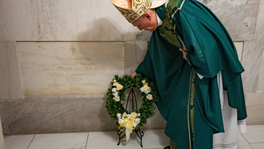 Archbishop Gabriele G. Caccia, apostolic nuncio to the United States, places a wreath at the crypt of Archbishop John Carroll, the first bishop of the United States, following Sunday Mass Oct. 25, 2026, at the Basilica of the National Shrine of the Assumption of the Blessed Virgin Mary in Baltimore. (OSV News photo/Kevin J. Parks, Catholic Review)