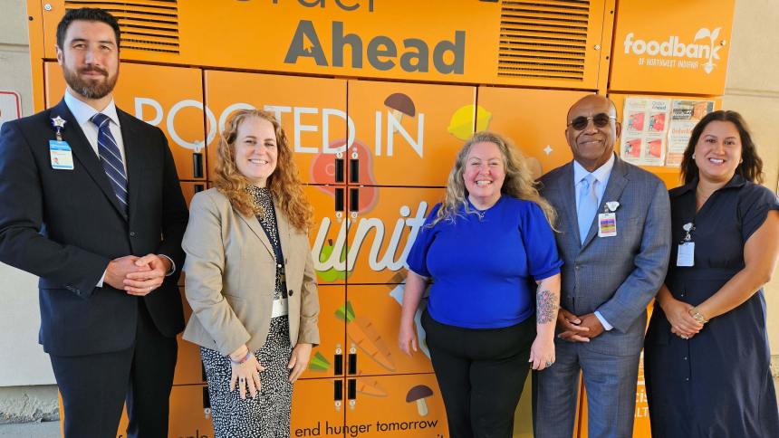 Franciscan Health Munster and Dyer COO Sean Leahy, Food Bank of Northwest Indiana Vice President of Development and Communications Dr. Natalie Krivas, Food Bank of Northwest Indiana Emerging Technologies Coordinator Julie Anderson, Franciscan Health Dyer, Crown Point and Munster President and CEO Raymond Grady and Director of Community Health Improvement for Franciscan Health Danielle Crowder in front of the new OrderAhead food locker at Franciscan Health Dyer. 