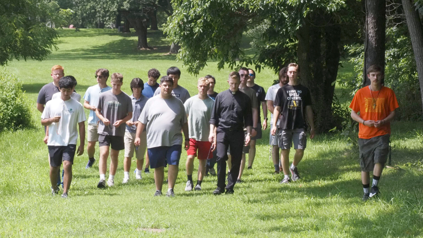 Seminarians and discerners take a Rosary walk during the three-day Quo Vadis? Where are you going Discernment retreat at Camp Lawrence on August 3. (Deacon Bob Wellinski photo)