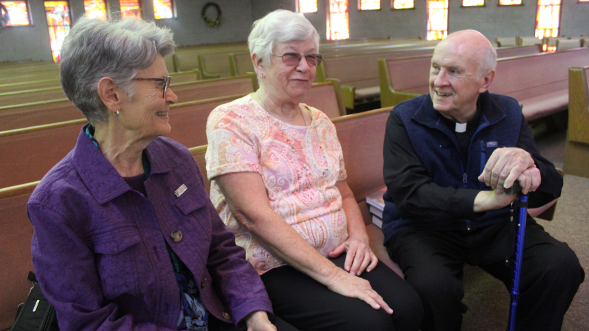 Father Ronald S. Zgunda (right), who grew up in Our Lady of Perpetual Help in Hammond, visits with Sister Joyce Diltz, P.H.J.C. And Joyce Oboy, who attended the parish school, as did Father Zgunda, a senior priest from the Diocese of Evansville who has retired to his family home "just a stone's throw" from the church. All three were in attendance for the closing Mass of the parish on Oct. 4.  (Marlene A. Zloza)