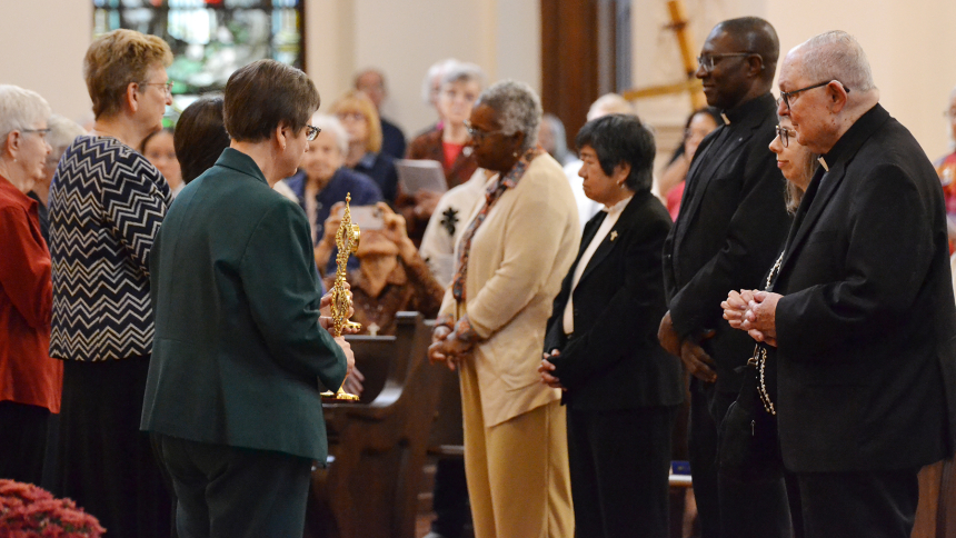 : Representatives from the five Dioceses in Indiana preparing to receive their first-class relic.